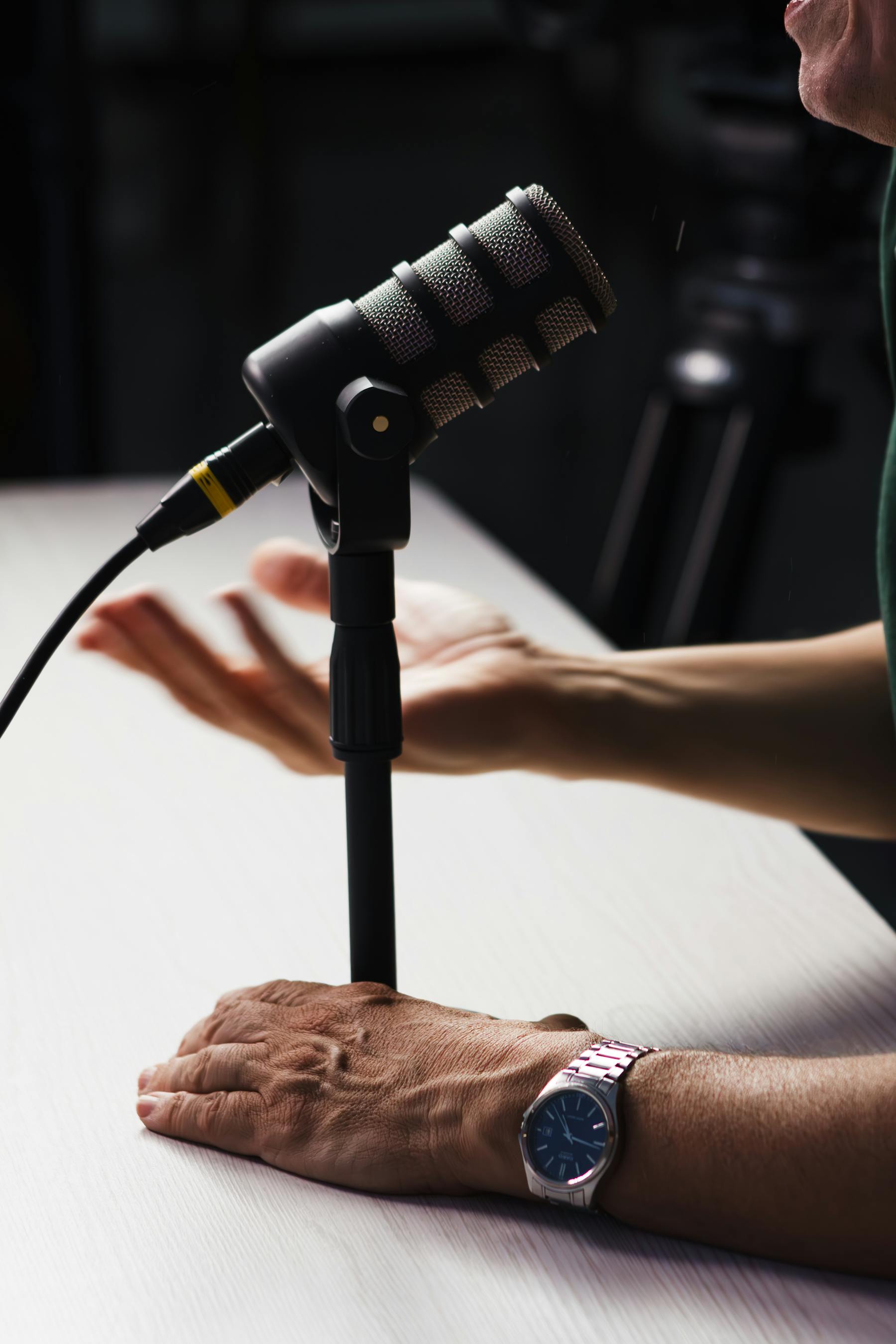 Podcast studio microphone setup during a recording conversation.